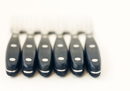 Close up six forks isolated on white background