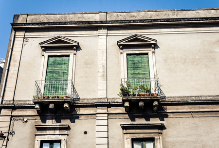 Decoration stucco of balcony in old baroque building in Catania, traditional architecture of Sicily, Italyのeditorial素材