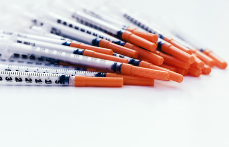 Pile of medical syringes for insulin for diabetesの写真素材