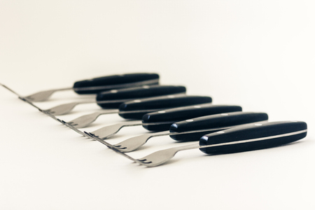 Close up six forks isolated on white backgroundの写真素材