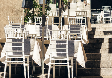 Serving on the table on terrace in the restaurant in Taormina, Sicily, Italy, setting for dinerの写真素材