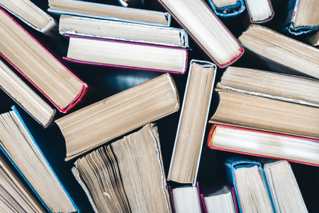 Stack of old book education concept background, many books piles with copy space for text