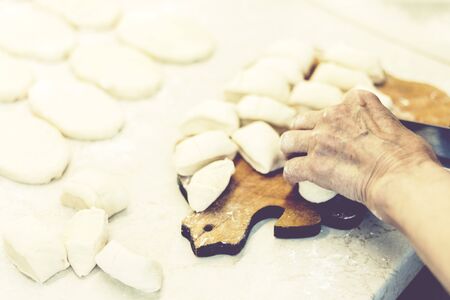 Preparing, cooking, making homemade fried patties or pies with potato and beans