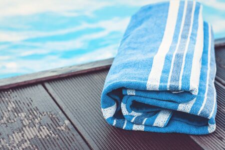 blue towel near swimming pool, tropical backgroundの写真素材