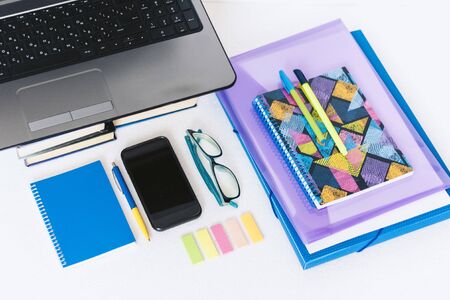 School stationery accessories - notebook, copybook, laptop, plastic folder, pens, glasses, paper...