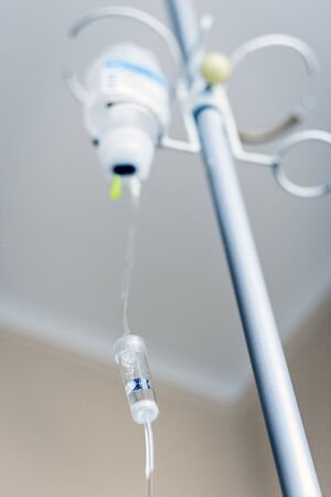 Close-up bottle of medicine on dropper system in the operating room (medical background with an intravenous IS)の写真素材