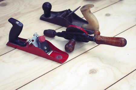 Joinery â old wooden plane, wood polishing tool in a workshop of the carpenter, retro conceptの写真素材