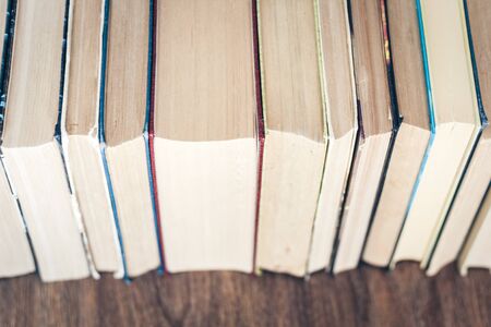 stack of old book education concept background, many books piles with copy space for text
