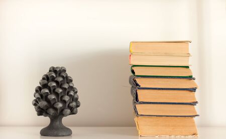 stack of old book and vase, education concept background, many books piles with copy space for textの写真素材