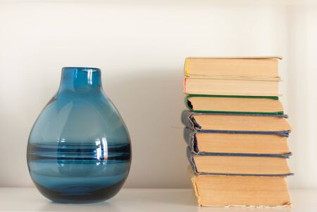 stack of old book and vase, education concept background, many books piles with copy space for text