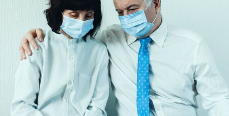 Coronavirus quarantine and Air pollution pm2.5 concept. Old sick man and woman wearing blue respirator mask for protect.の写真素材