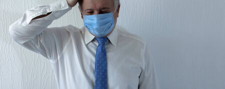 Coronavirus quarantine and Air pollution pm2.5 concept. Old sick man wearing respirator mask for...