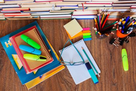 School stationery accessories - notebook, copybook stack with plastic holder pencils, pens, markers,...