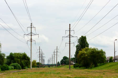 High-voltage DC line in a city park near the lake, Kiev, Ukraineの写真素材