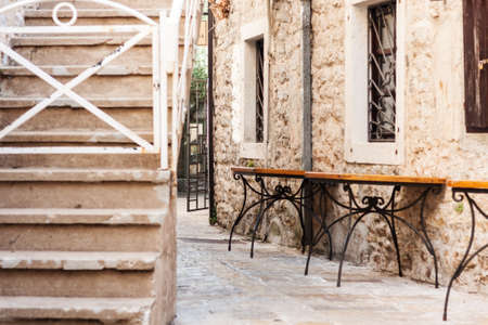 Street and landscape of Old town Budva, Montenegro: medieval city, ancient walls and red tiled roof, beautiful viewの写真素材