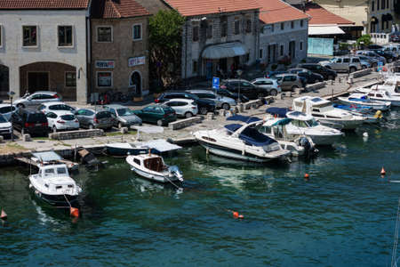 Kotor, Montenegro - August 17 2021: pier with boats and ships in the Bay of Kotor, Adriatic seaのeditorial素材