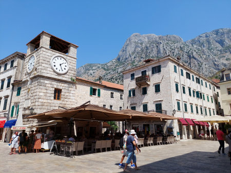 Kotor, Montenegro - August 17 2021: clock tower in the Square of the Arms, in the medieval walled old city, history Center of Kotorのeditorial素材