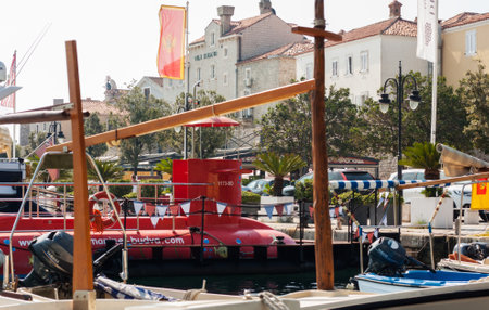 Budva, Montenegro - August 15 2021: city port with pleasure boats, fishing boats and yachts near the old town of budvaのeditorial素材