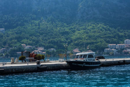Kotor, Montenegro - August 17 2021: pier with boats and ships in the Bay of Kotor, Adriatic seaのeditorial素材