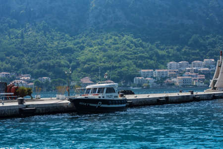 Kotor, Montenegro - August 17 2021: pier with boats and ships in the Bay of Kotor, Adriatic seaのeditorial素材