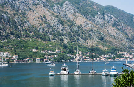 Kotor, Montenegro - August 17 2021: pier with boats and ships in the Bay of Kotor, Adriatic seaのeditorial素材