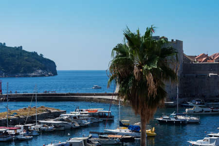 Dubrovnik, Croatia - August 13 2021: view of the port with sail and pleasure boats with background of landmark Dubrovnik old townのeditorial素材