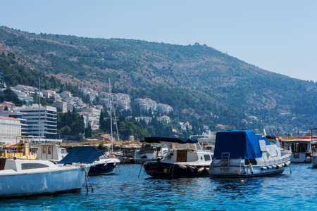 Dubrovnik, Croatia - August 13 2021: view of the port with sail and pleasure boats with background of landmark Dubrovnik old townのeditorial素材