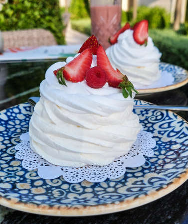 Pavlova cake with meringue, strawberries and creamの写真素材
