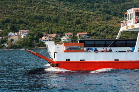 Bay of Kotor, Herceg Novi, Montenegro - August 13 2021: barge ship transports tourists and cars across the bayのeditorial素材