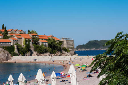 Budva, Montenegro - August 12 2021: public beach near Saint Stephen's island (Sveti-Stefan)のeditorial素材