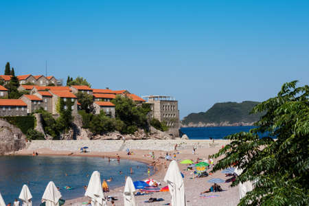 Budva, Montenegro - August 12 2021: public beach near Saint Stephen's island (Sveti-Stefan)のeditorial素材