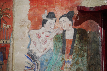 Nan, Thailandâ -â Decemberâ 10, 2018â: The famousâ mural painting of a man whispering to theâ ear of a woman at Watâ Phumin in Nan, Thailand.のeditorial素材