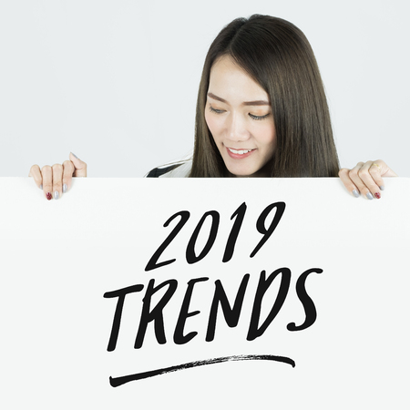 Businesswoman holding placards with 2019 Trends sign.の写真素材