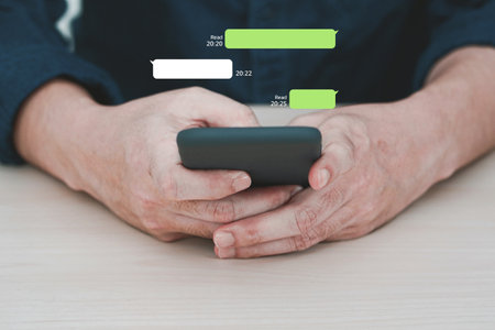 Man using instant messaging app on mobile phone. Mobile chat online.