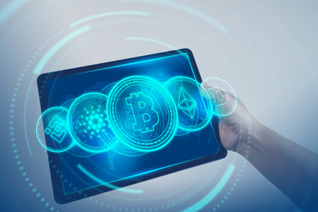 Bitcoin, Ethereum, Cardano, Dogecoin, Binance Coin symbol hologram on tablet screen. Cryptocurrency...