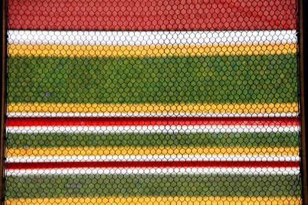 colorful beehive, net on tile in Thai temple, Bangkok, Thailand.