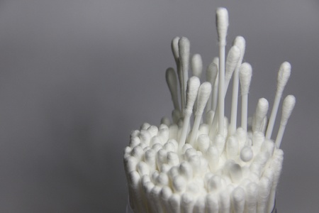 cotton swab in clear bottle