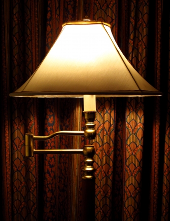 stand lamp and red curtain in the roomの写真素材