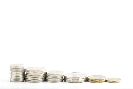 stacked coins on a white background in decreasing heights