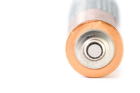 Close-up of a used battery with a white background