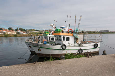 Fishing boats berthed on Ave River in Vila do Conde, Portugalのeditorial素材