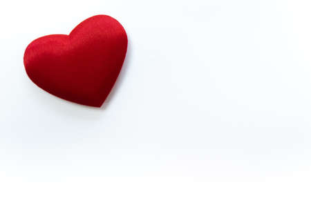 Red love heart on white background. Copy space on rightの写真素材