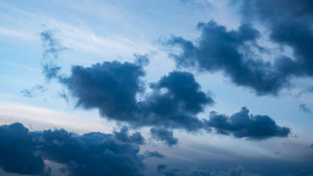 Dark dramatic storm clouds gather in the skyの写真素材