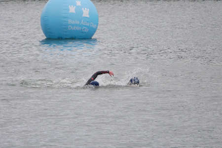 People swimming in the River Liffey in Dublin, Ireland, during the annual Liffey swimのeditorial素材