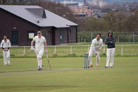 Men playing cricket on a Sunday afternoon in the park. Phoenix Park, Dublinのeditorial素材