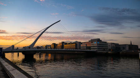 Dublin City skyline at sunset, River Liffey and Samuel Beckett Bridgeのeditorial素材