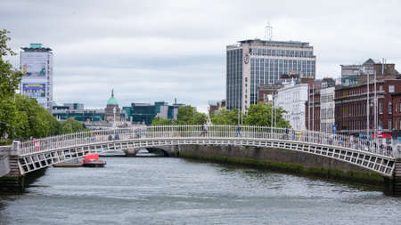 River Liffey and Ha'Penny Bridge in Dublin Ireland.のeditorial素材