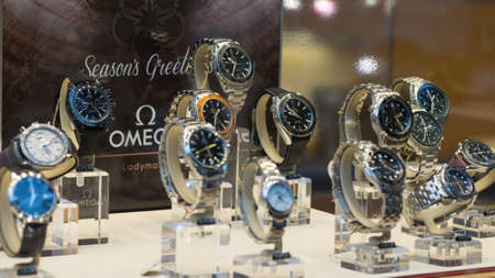Luxury Omega Seamaster watches on display in a store window, shallow depth of field.のeditorial素材