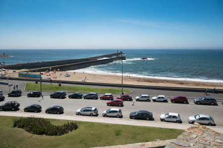 Beach and Pier in Foz, Porto, Portugal. Praia da Foz, on a sunny summer day.のeditorial素材