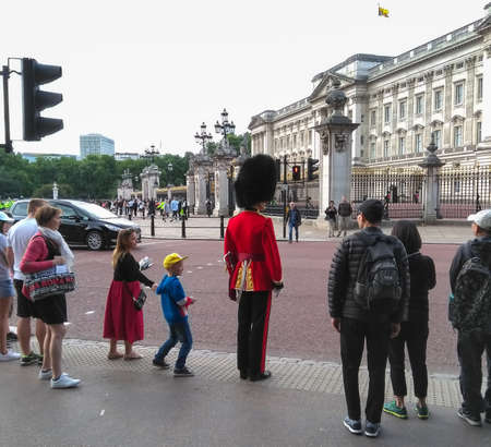 Queen's Royal Guard crossing road outside Buckingham Palaceのeditorial素材